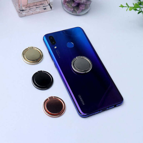 Metal finger ring holder stands on a smartphone, showcasing various colors for secure grip and ease of use.