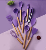 Colorful purple silicone kitchenware utensils set with wooden handles, heat resistant and non-stick cooking tools.