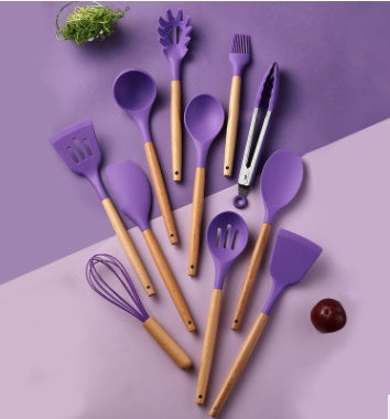 Colorful purple silicone kitchenware utensils set with wooden handles, heat resistant and non-stick cooking tools.