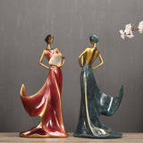 Elegant figurines of women in flowing dresses, ideal for home decor or as a unique gift for special occasions.