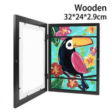 A4 magnetic wooden photo frame for kids featuring vibrant toucan art and colorful flowers.