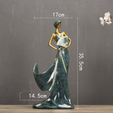 Elegant resin figurine of a woman in a long dress, 35.5cm tall, ideal for home decoration and special gifts.