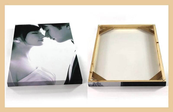 Natural wood photo frame showing a couple's portrait, with a view of the back structure for wall hanging.