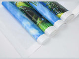 Rolled canvas prints showcasing vibrant palm tree designs perfect for home decor, ready to frame.