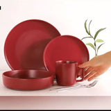 16 luxury ceramic baking utensils in rich red, including plates and mugs, perfect for stylish cooking and dining.