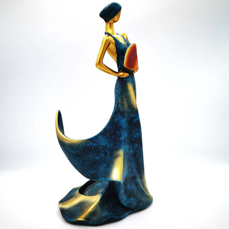 Handcrafted resin ornament of a graceful figure in blue and gold, decorative for home living room.