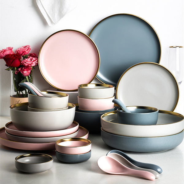 Nordic style porcelain dishes and utensils set in solid colors with gold trim, perfect for serving tea.