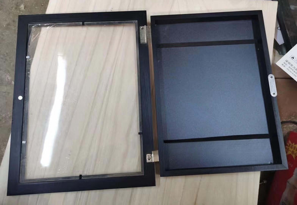 Black rectangular acrylic photo frame opened, ideal for children's art projects, showcasing modern simplicity.