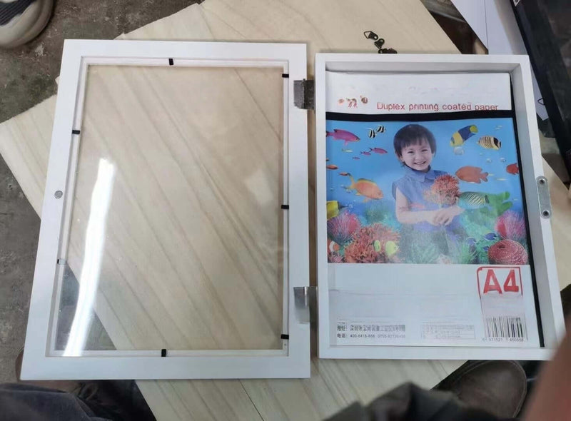 Children's art frame with acrylic cover and colorful print, perfect for displaying kids' artwork, size 26x35x4cm.